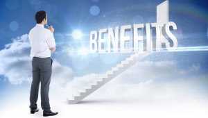 The word benefits and businessman holding glasses against steps